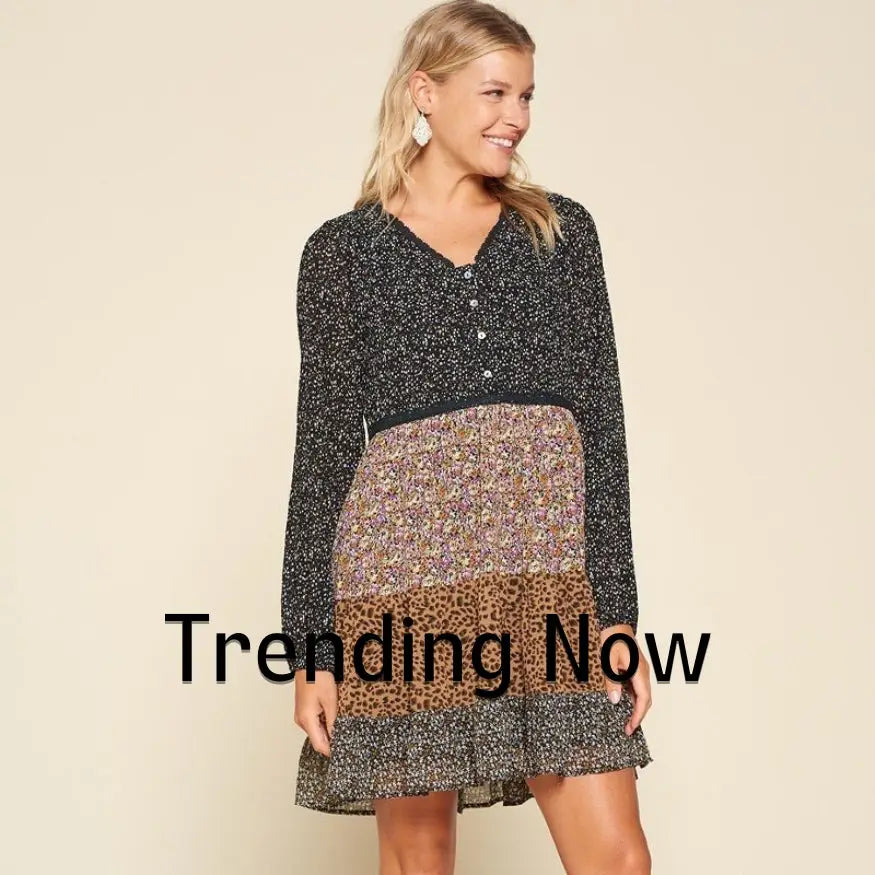 A woman in a black and white dress with a leopard print skirt from Trending Now collection.